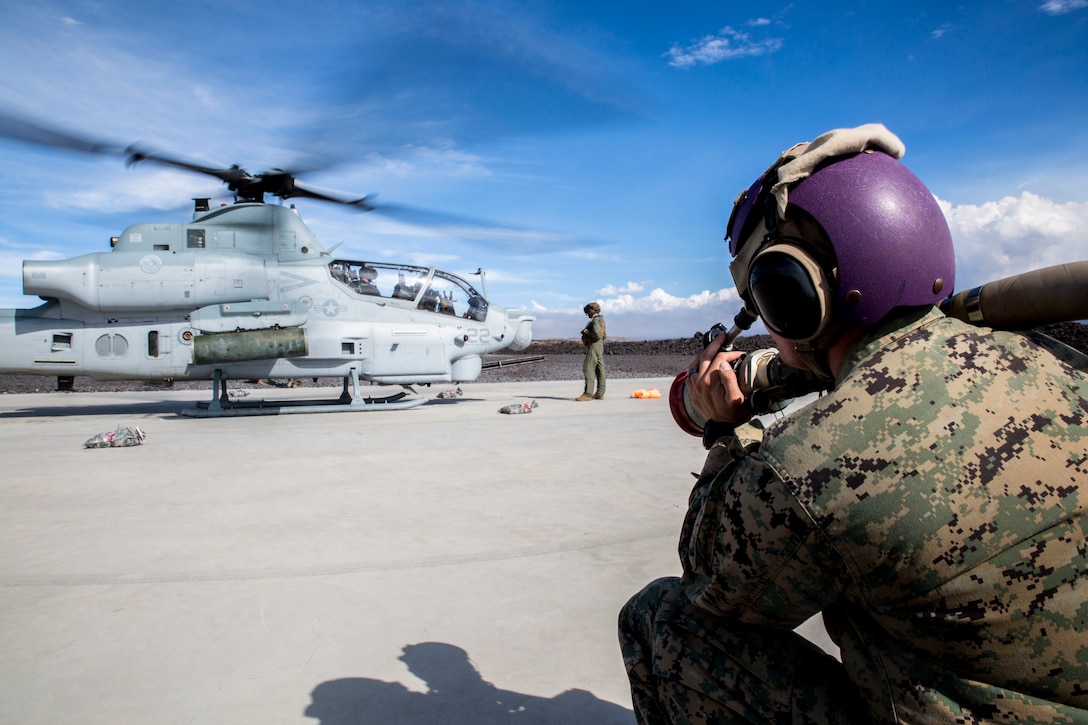 U.S. Marine Corps Cpl. Garrett Subik, a bulk fuel specialist with Marine Wing Support Detachment 24, prepares to fuel a AH-1W Super Cobra helicopter during a field test for an Expeditionary Mobile Fuel Additization Capability system as part of Rim of the Pacific (RIMPAC) exercise at Pohakuloa Training Area, Hawaii, July 18, 2018. RIMPAC provides high-value training for task-organized, highly capable Marine Air-Ground Task Force and enhances the critical crisis response capability of U.S. Marines in the Pacific.