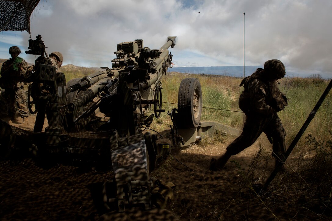 U.S. Marines with Bravo Battery, 1st Battalion, 12th Marine Regiment, fire a M777 towed 155 mm howitzer during live-fire training as part of Rim of the Pacific (RIMPAC) exercise at Pohakuloa Training Area, Hawaii, July 17, 2018. RIMPAC provides high-value training for task-organized, highly capable Marine Air-Ground Task Force and enhances the critical crisis response capability of U.S. Marines in the Pacific.