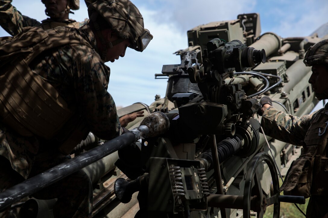 U.S. Marines with Bravo Battery, 1st Battalion, 12th Marine Regiment, load a round in a M777 towed 155 mm howitzer during live-fire training as part of Rim of the Pacific (RIMPAC) exercise at Pohakuloa Training Area, Hawaii, July 17, 2018. RIMPAC provides high-value training for task-organized, highly capable Marine Air-Ground Task Force and enhances the critical crisis response capability of U.S. Marines in the Pacific.