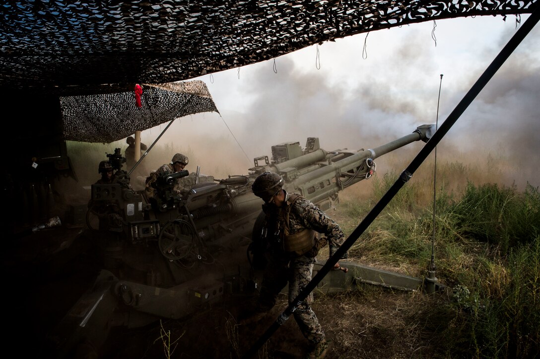 U.S. Marines with Bravo Battery, 1st Battalion, 12th Marine Regiment, fire a M777 towed 155 mm howitzer during live-fire training as part of Rim of the Pacific (RIMPAC) exercise at Pohakuloa Training Area, Hawaii, July 17, 2018. RIMPAC provides high-value training for task-organized, highly capable Marine Air-Ground Task Force and enhances the critical crisis response capability of U.S. Marines in the Pacific.