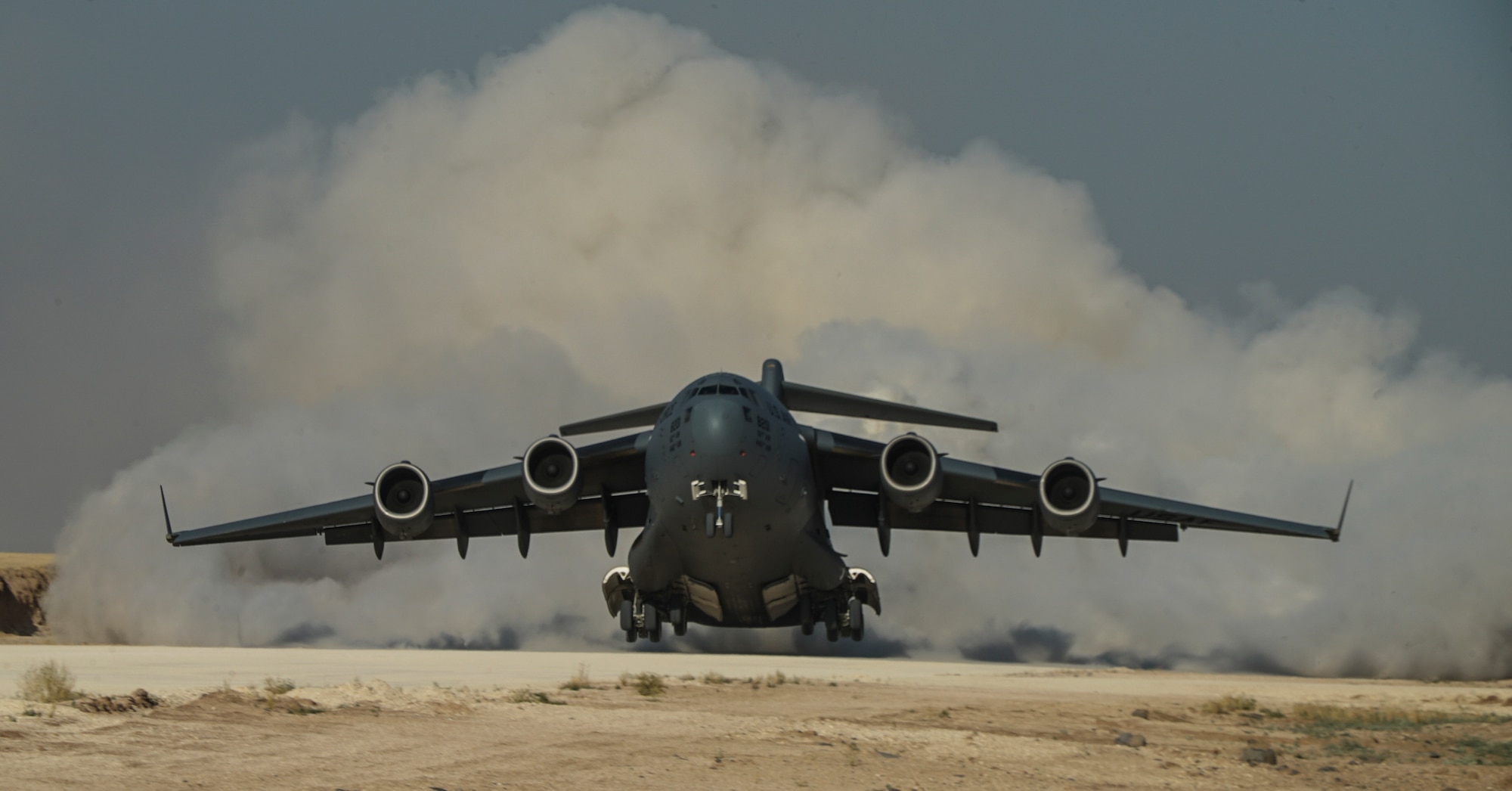 A U.S. Air Force C-17 Globemaster departs from a Coalition airfield in Northeast Syria, June 26, 2018. The C-17 mission was in support of Operation Inherent Resolve. In conjunction with partner forces, CJTF-OIR's mission is to defeat ISIS in designated areas of Iraq and Syria and set conditions to increase regional stability. (U.S. Air Force photo by SrA Izabella Sullivan)