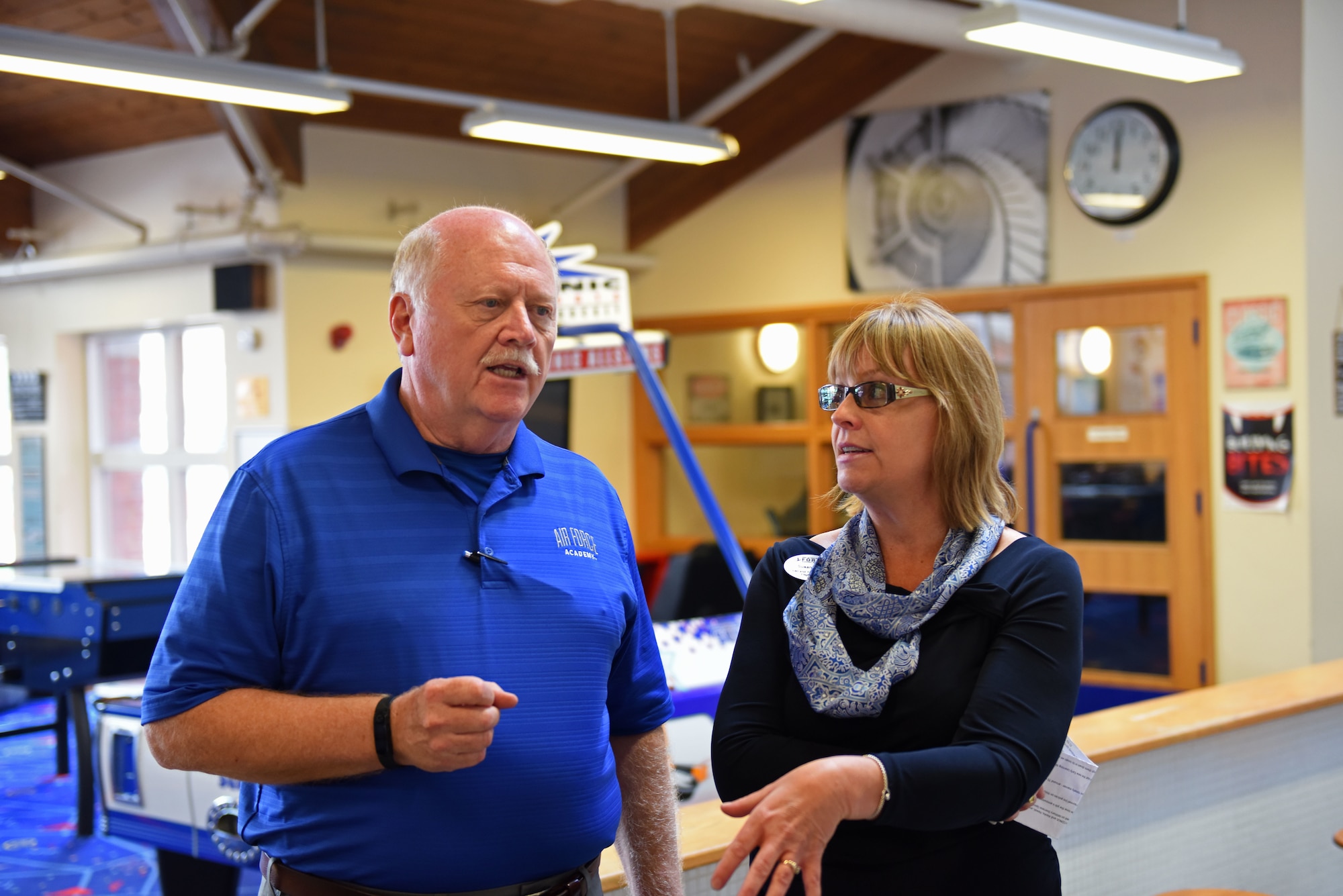 U.S. Air National Guard Col. (ret.) Jay Hone, left, talks to Susan Long 100th Force Support Squadron, Family Service Flight Chief, while visiting the Child Development Center and the Youth Center on RAF Mildenhall, England, July 12, 2018. Hone is the husband of Secretary of Air Force Heather Wilson. During his time at RAF Mildenhall he met with Airmen and visited different support agencies on base for Airmen and their families. (U.S. Air Force photo by Senior Airman Luke Milano)