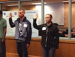 Nate and Irene Miller of Geauga County, Ohio, take the oath together May 25, 2018, at the Military Entrance Processing Station in Cleveland. The couple, married for four years, enlisted together into the Ohio Army National Guard and are scheduled to go to basic training in October, and will be assigned to the 1484th Transportation Company, based in North Canton, Ohio.