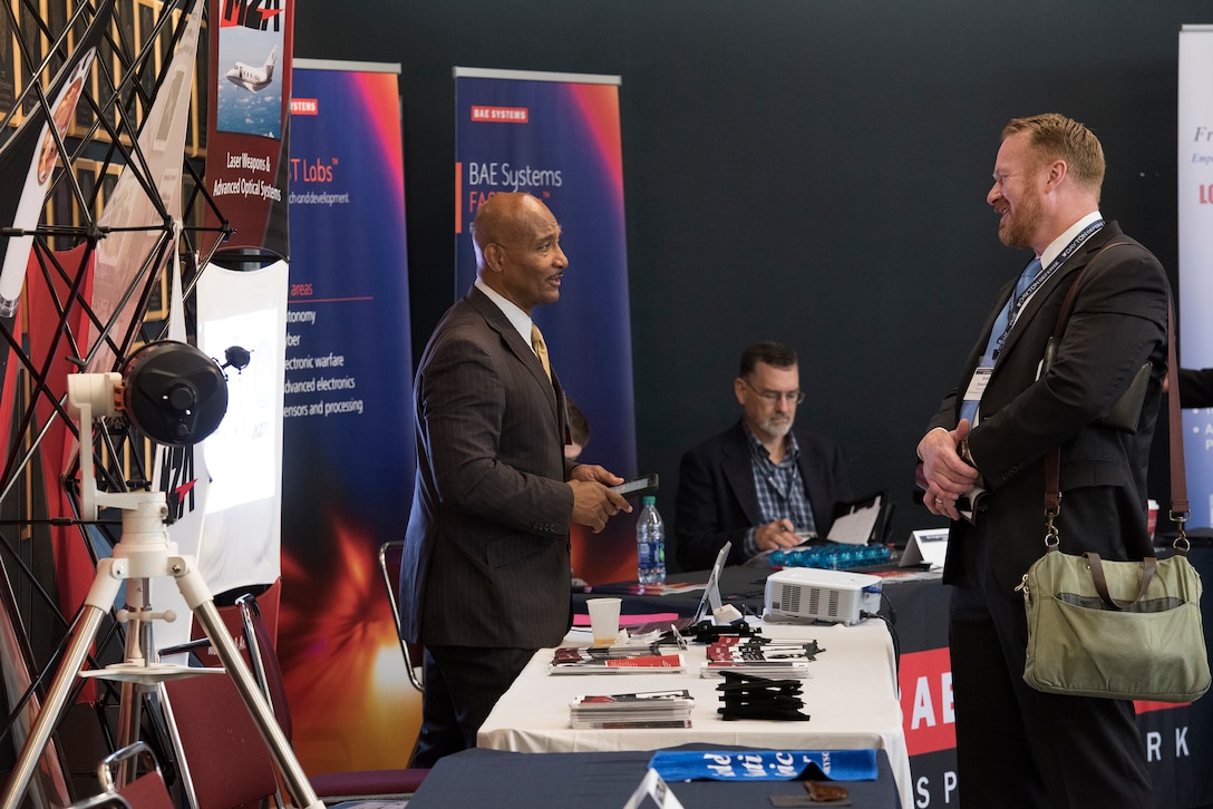 Dr. Phil Macklin, director of MZA Associates Corporation, Albuquerque, New Mexico, speaks to a client at the Wright Dialogue with Industry event July 17, 2018 at the Dayton Convention Center.