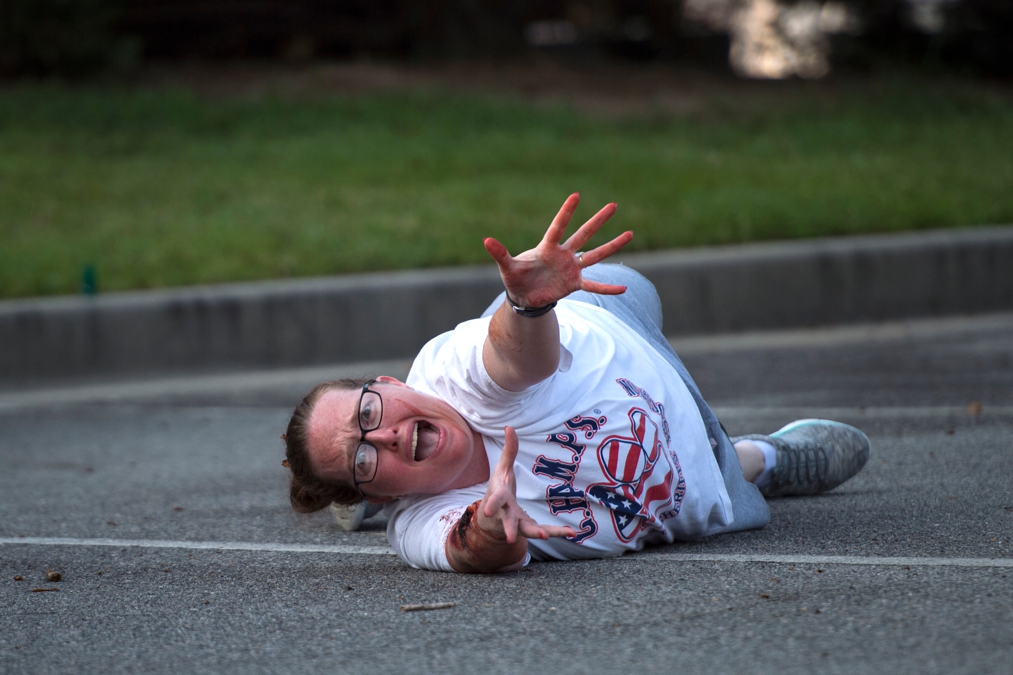 A simulated victim cries for help during a mass casualty exercise, July 19, 2018, at Moody Air Force Base, Ga. The exercise tested the MDG’s emergency response capabilities during a chemical attack. (U.S. Air Force photo by Senior Airman Janiqua P. Robinson)