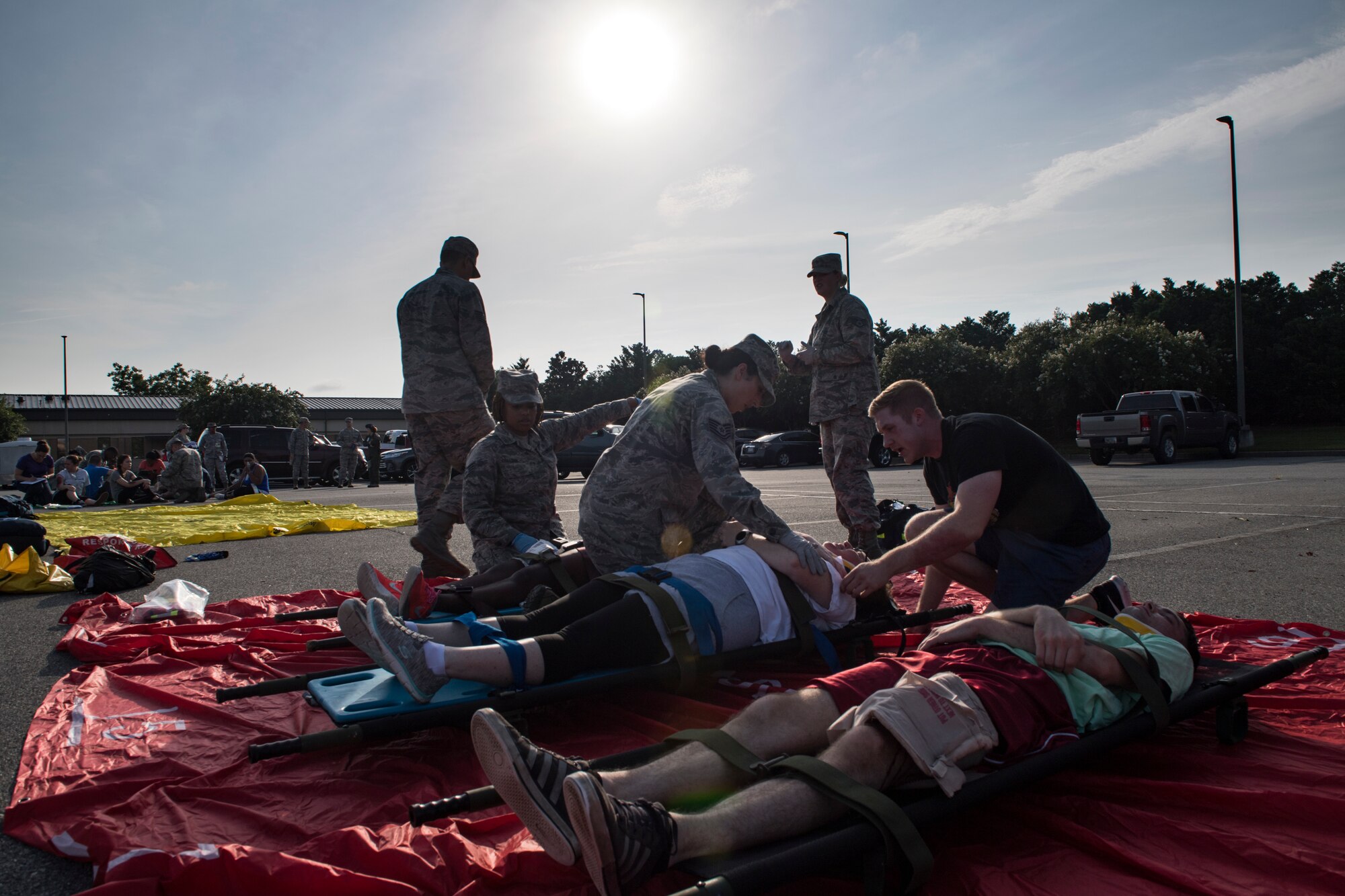 Airmen from the 23d Medical Group treat simulated victims during a mass casualty exercise July 19, 2018, at Moody Air Force Base, Ga. The exercise tested the MDG’s emergency response capabilities during a chemical attack. (U.S. Air Force photo by Senior Airman Janiqua P. Robinson)