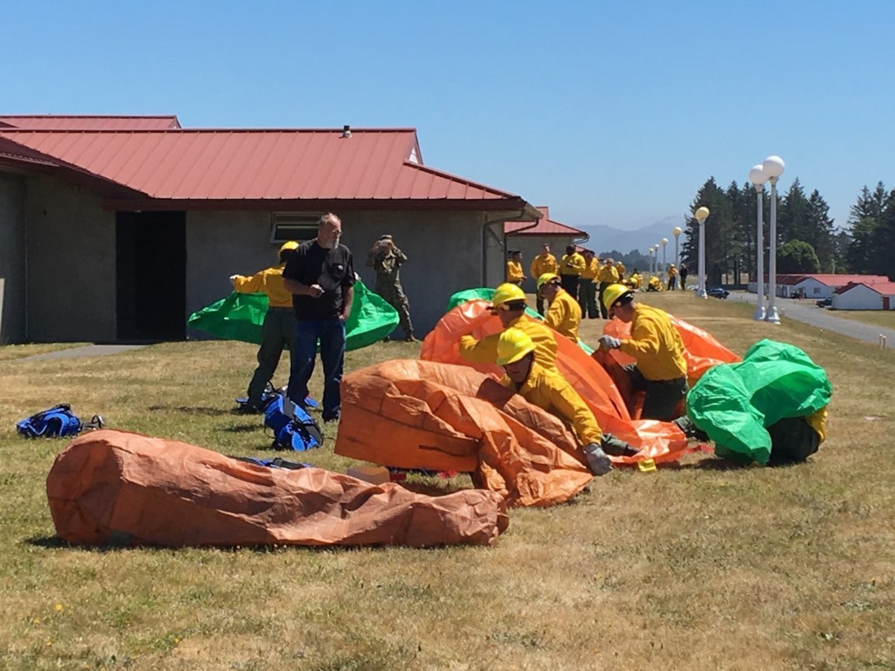 Oregon National Guardsmen deploy emergency fire shelters during training.