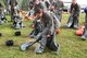 Lt. Col. Wendy Squarica, 238th Combat Training Squadron commander and Citizen Airman, dons an anti-exposure suit while participating in water survival and rescue training July 14, 2018. The suits are worn by aircrew in the eventuality they must be in water where the temperature is below 60 F. The hands-on water instruction included donning cold-water exposure suits; inflating and swimming with inflatable life preservers; and boarding and utilizing a 20-person survival raft.