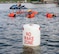 Citizen Airmen, assigned to the 170th Group at Offutt Air Force Base, Nebraska, swim toward a raft under the watchful eye of Staff Sgt. Kevin Battista, 55th Operational Support Squadron Survival Evasion Resistance Escape specialist, while participating in water survival and rescue training July 14, 2018 during monthly inactive duty training. The hands-on water instruction included donning cold-water exposure suits; inflating and swimming with inflatable life preservers; and boarding and utilizing a 20-person survival raft.