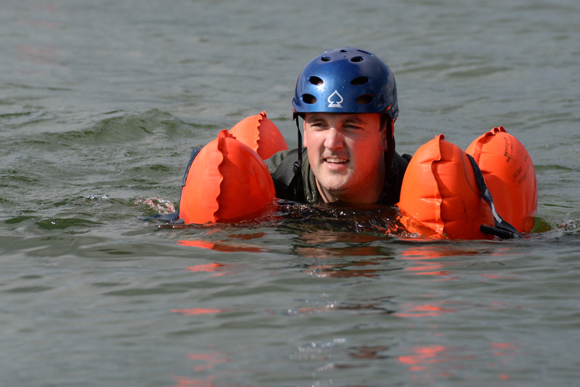 Maj. Bill Torson, member of the 170th Group assigned to Offutt Air Force Base, Nebraska, swims to shore after participating in water survival and rescue training July 14, 2018 during monthly inactive duty training. The hands-on water instruction included donning cold-water exposure suits; inflating and swimming with inflatable life preservers; and boarding and utilizing a 20-person survival raft.