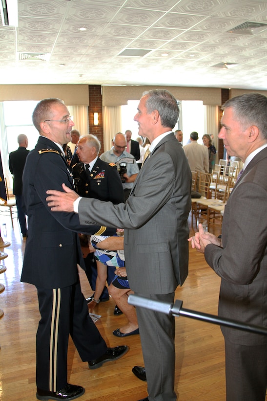 DASA-CW David Leach congratulates out-going NAD commanding general Maj. Gen. William H. Graham