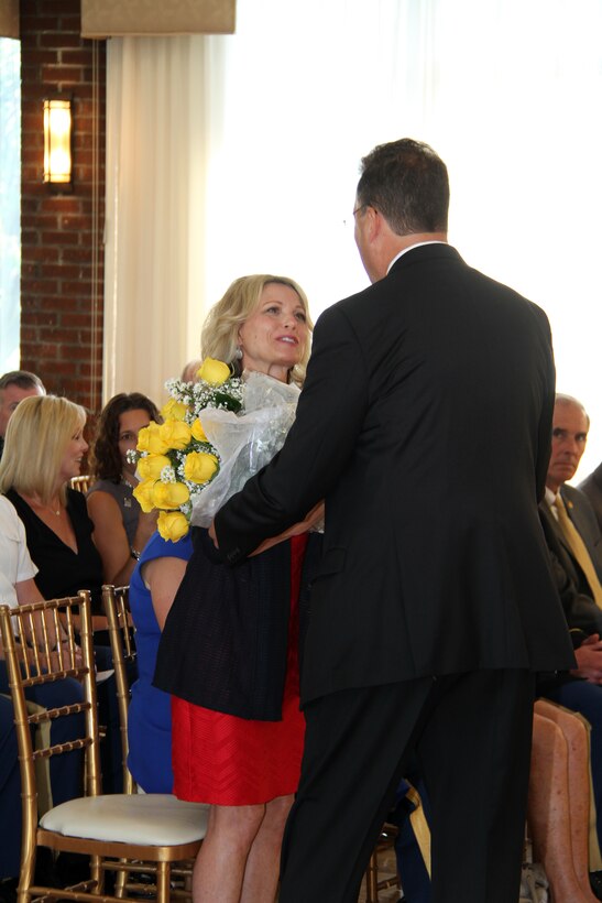 Civilian employee Robert Sielaw presents Debbie Milhorn, wife of Maj. Gen. Jeffrey Milhorn, with yellow roses welcoming her to the U.S. Army Corps of Engineers North Atlantic Division.