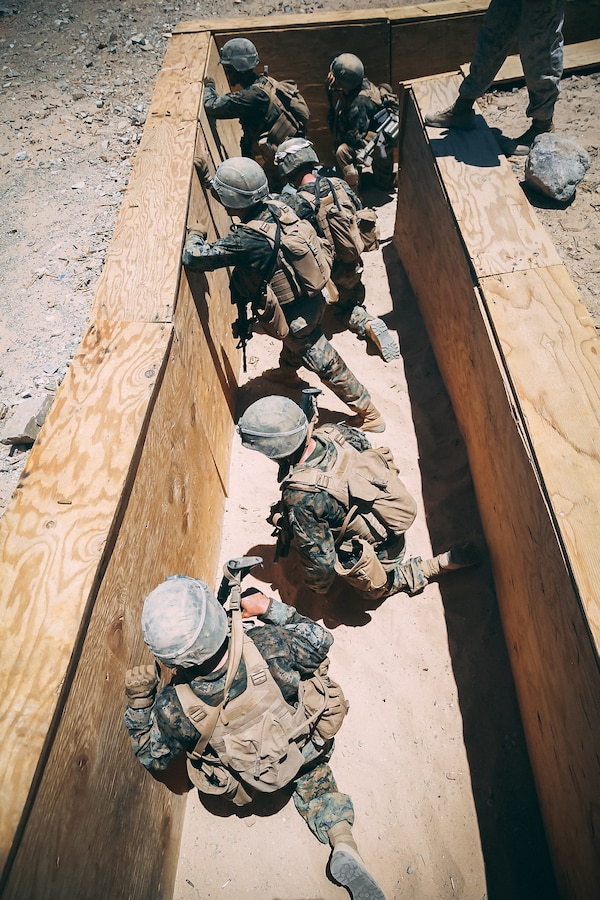 Marines in the Infantry Officer Course complete their live fire training exercise at Range 410A aboard the Marine Corps Air Ground Combat Center, Twentynine Palms, Calif., June 9, 2018. The Purpose of IOC is to train and educate newly selected infantry and ground intelligence officers in leadership, infantry skills, character required to serve as infantry platoon commanders in the operating forces. (U.S. Marine Corps photo by Lance Cpl. William Chockey)