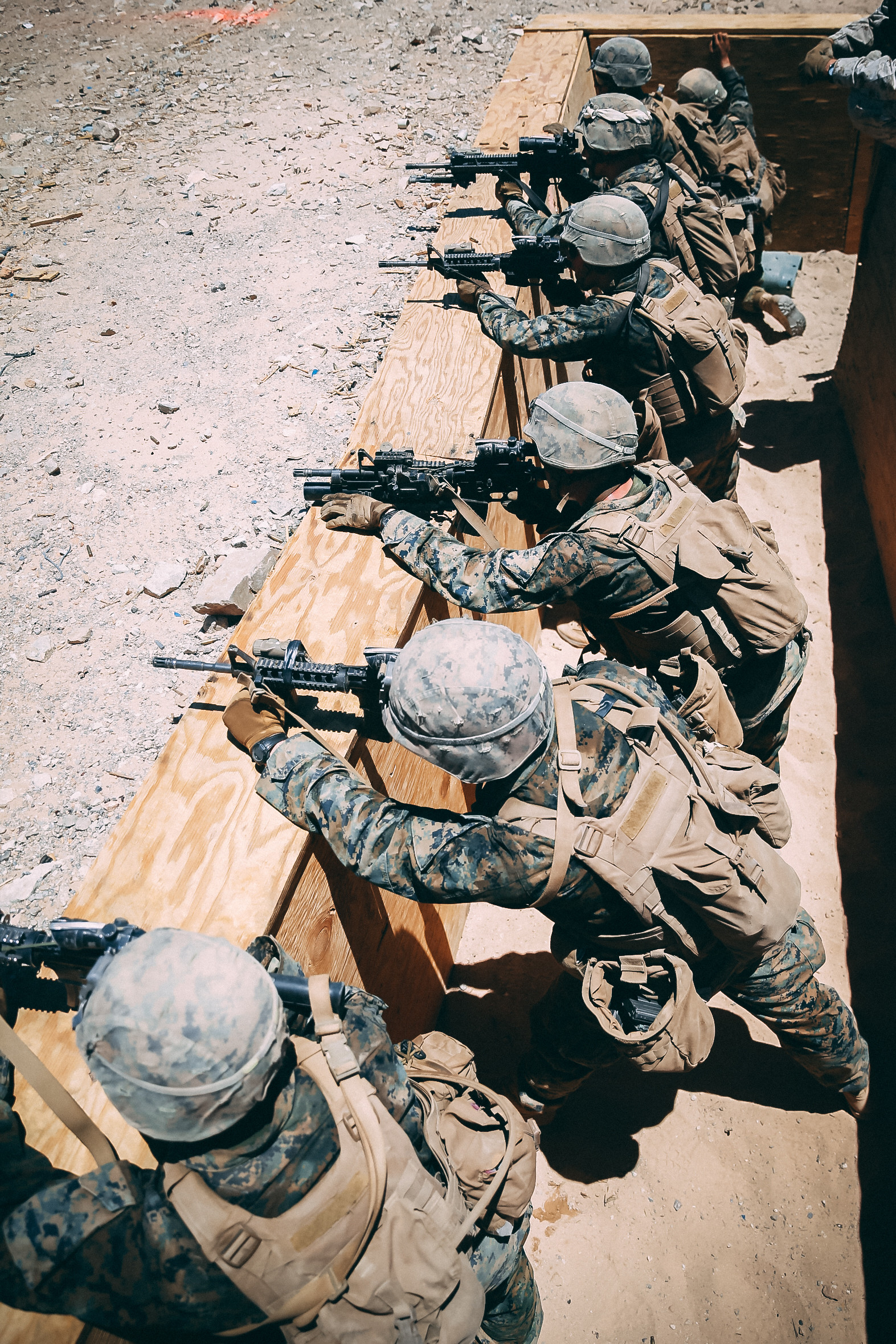 Marines in the Infantry Officer Course fire at the second enemy trench during a live fire training exercise at Range 410A aboard the Marine Corps Air Ground Combat Center, Twentynine Palms, Calif., June 9, 2018. The Purpose of IOC is to train and educate newly selected infantry and ground intelligence officers in leadership, infantry skills, character required to serve as infantry platoon commanders in the operating forces. (U.S. Marine Corps photo by Lance Cpl. William Chockey)