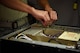 Airman 1st Class Jesus Alarcon, 14th Operations Support Squadron Radar, Airfield and Weather Systems (RAWS) journeyman, returns a piece on a radio system July 13, 2018, on Columbus Air Force Base, Mississippi. The radios are older than some trainer aircraft on Columbus AFB, but allow clear communication between pilots and air traffic controllers. (U.S. Air Force photo by Airman 1st Class Keith Holcomb)