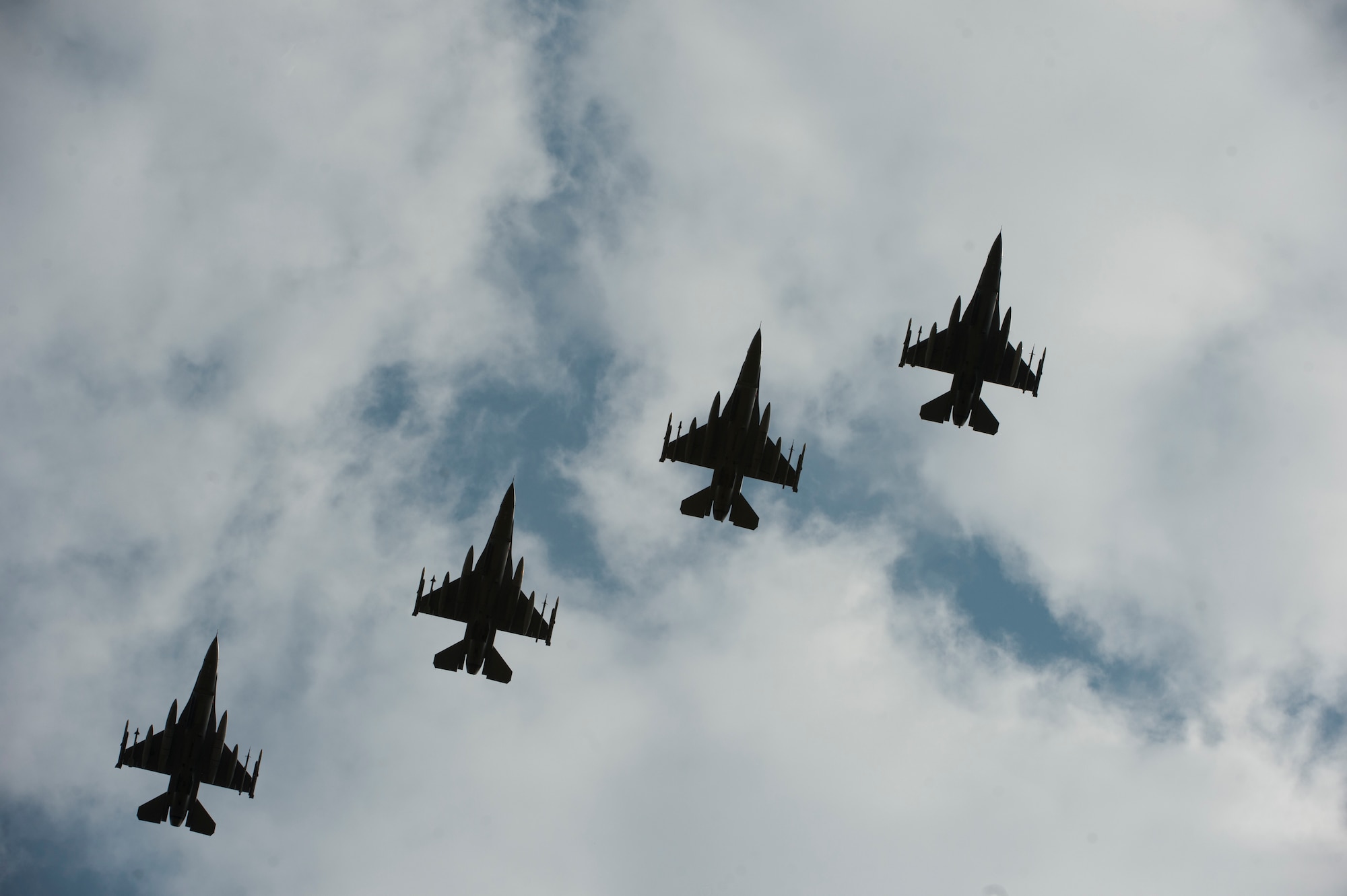 Four F-16C Fighting Falcons from the 31st Fighter Wing, 510th Fighter Squadron, Aviano Air Base, Italy, fly over Royal Air Force Lakenheath, England, July 20, 2018. The 510th FS are participating in a bilateral training event to enhance interoperability, maintain joint readiness and reassure our regional allies and partners. (U.S. Air Force photo by Master Sgt. Eric Burks)