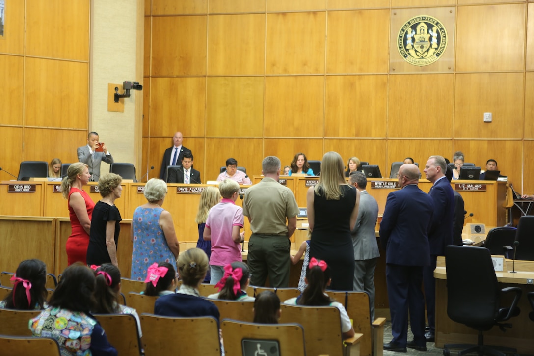 Col. Jason G. Woodworth, commanding officer of Marine Corps Air Station Miramar, and his family listen as the city council of San Diego honor him for his accomplishments at MCAS Miramar during a city council meeting in San Diego City Hall, San Diego, July 17, 2018. San Diego proclaimed July 17 as “Colonel Jason Woodworth Day”, after recognizing Col. Woodworth’s accomplishments and role in building a better relationship with the city and MCAS Miramar, as commanding officer. (U.S. Marine Corps Photo by Sgt. Daniel Auvert/Released)