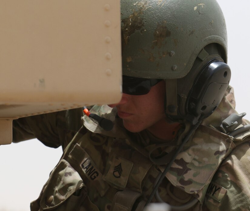 Staff Sgt. Brian Lang, a High Mobility Artillery Rocket System crew chief for Bravo Battery, 1st Battalion, 14th Field Artillery Regiment, 65th Field Artillery Brigade, Task Force Spartan, works the controls on his HIMARS during exercise Golden Sparrow on June 29, 2018. Lang and other Soldiers from Bravo Battery recently rotated back to UAE after supporting missions in Afghanistan.