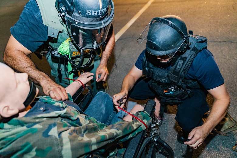 Participants of Operation Bono conduct an exercise that requires concise operational considerations with bomb incident management particular to aviation at the Palm Springs International Airport, Palm Springs, Calif., July 13, 2018. The purpose of Operation Bono is to provide unique training opportunities for federal, state, and local public safety bomb squads and military explosive ordnance disposal teams, as well as facilitates training and drills designed for bomb squads to employ their tactics while operating in the aviation domain in, and around PSP airport. (U.S. Marine Corps photo by Lance Cpl. Rachel K. Porter)