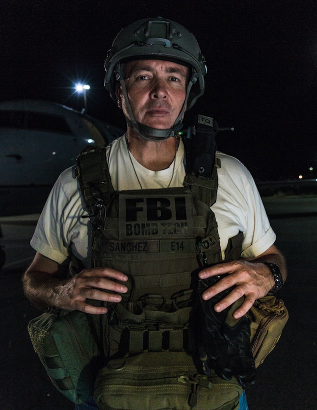 Rick Sanchez, special agent bomb technician, Federal Bureau of Investigation, gears up for Operation Bono at Palm Springs International Airport, Palm Springs, Calif., July 13, 2018. The purpose of Operation Bono is to provide unique training opportunities for federal, state, and local public safety bomb squads and military explosive ordnance disposal teams, as well as facilitates training and drills designed for bomb squads to employ their tactics while operating in the aviation domain in, and around PSP airport. (U.S. Marine Corps photo by Lance Cpl. Rachel K. Porter)