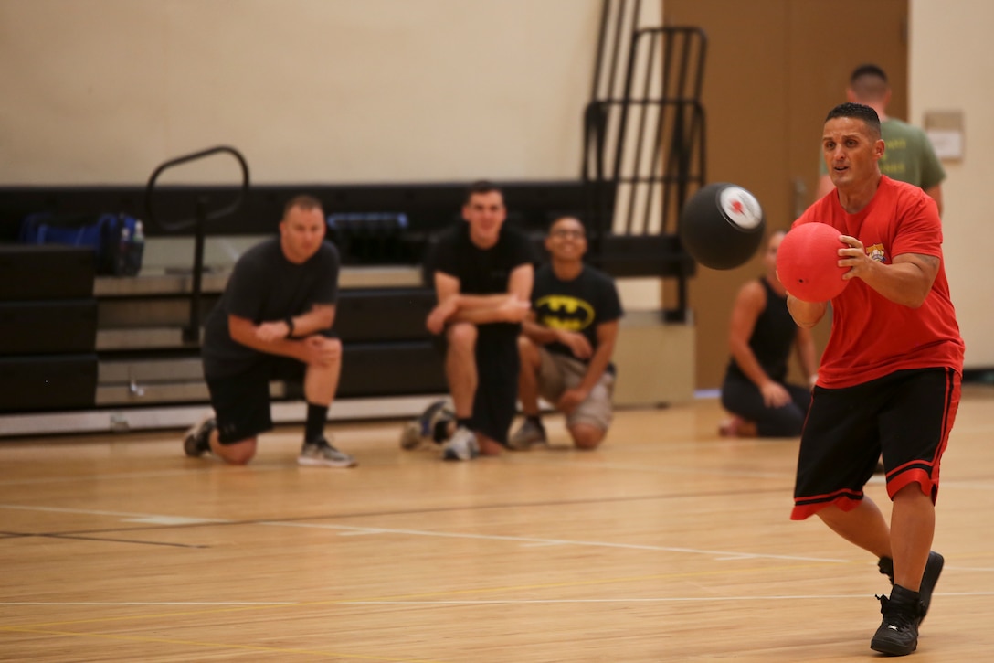 A Marine blocks a dodgeball during a tournament for the Semper Fit Summer Challenge aboard Marine Corps Air Station Beaufort July 18. The Summer Challenge is a program that promotes a healthy, active lifestyle and builds unit cohesion.
