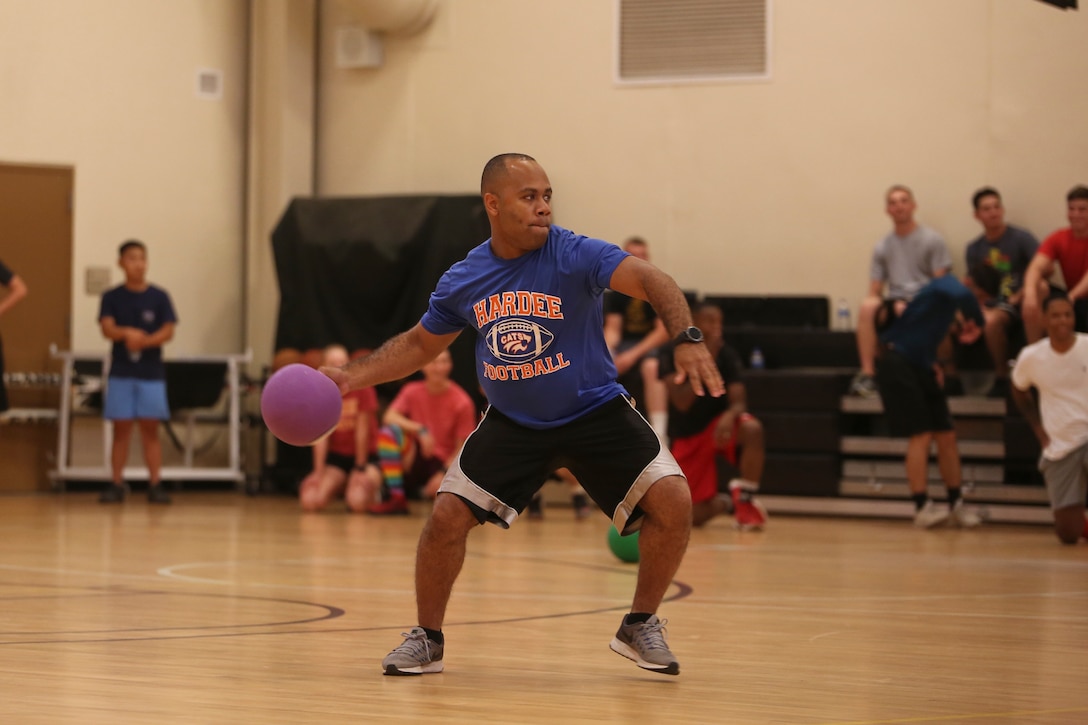 A Marine throws a dodgeball as part of a tournament for the Semper Fit Summer Challenge aboard Marine Corps
Air Station Beaufort July 18. The Summer Challenge is a program that promotes a healthy, active lifestyle and builds
unit cohesion.