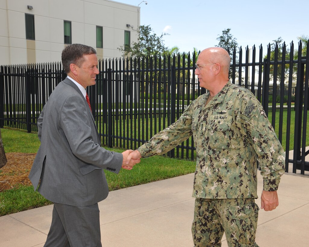 Adm. Kurt W. Tidd, commander of U.S. Southern Command, greets USAID Administrator Mark Green