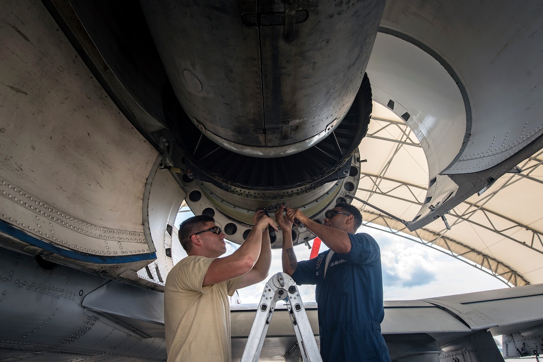 Airmen from the 74th Aircraft Maintenance Unit (AMU) repair a Turbo-Fan (TF)-34 engine on an A-10C Thunderbolt II, July 16, 2018, at Moody Air Force Base, Ga. Airmen from the 74th AMU play a part in the upkeep and maintenance of the Air Force’s largest operational A-10 fighter group. Maintainers from the 74th AMU accomplished a repair on a TF-34 engine in 48 operational hours. (U.S. Air Force photo by Airman 1st Class Eugene Oliver)
