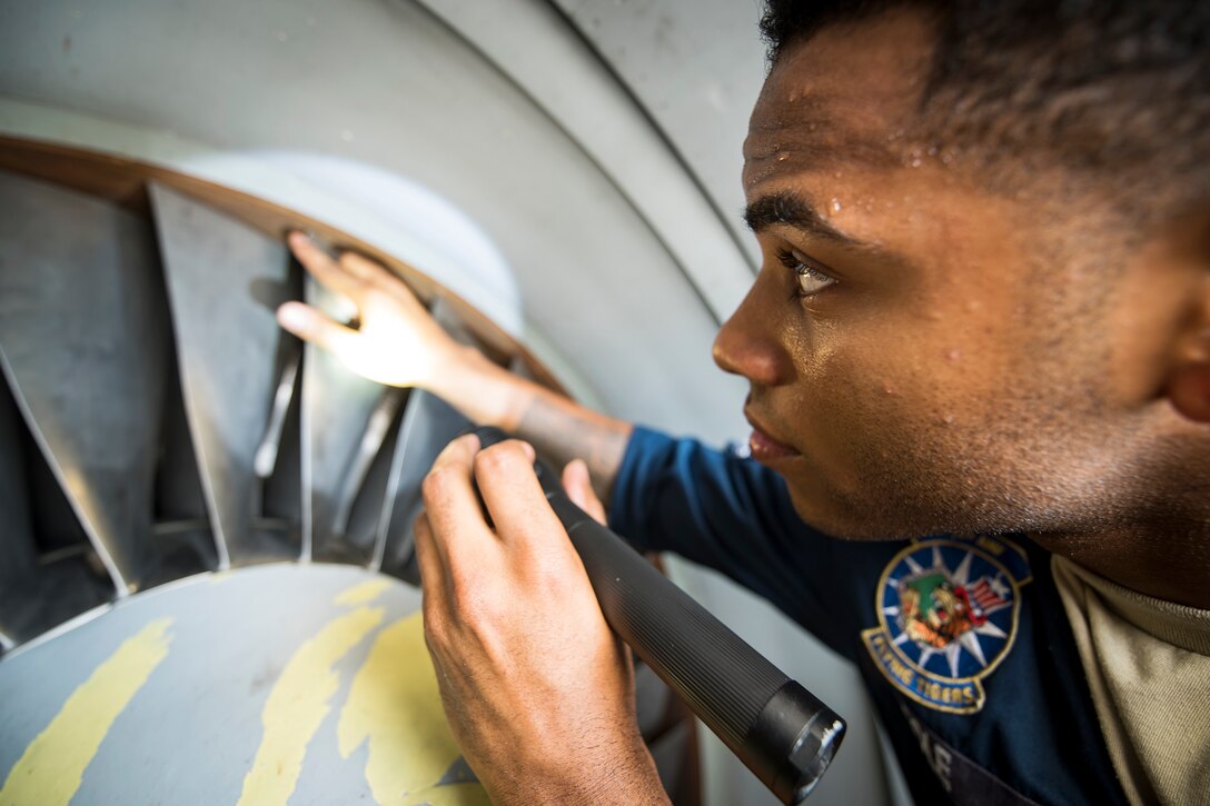 Senior Airman Shayne Cole, 74th Aircraft Maintenance Unit (AMU) aerospace propulsion technician, inspects the compression blades of a Turbo-Fan (TF)-34 engine, July 16, 2018, at Moody Air Force Base, Ga. Airmen from the 74th AMU are responsible for the upkeep and maintenance of the Air Force’s largest operational A-10C Thunderbolt II fighter group. Maintainers from the 74th AMU accomplished a repair on a TF-34 engine in 48 operational hours. (U.S. Air Force photo by Airman 1st Class Eugene Oliver)