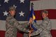U.S. Air Force Col. Derek O’Malley, 20th Fighter Wing commander, left, gives the 20th Maintenance Group (MXG) guidon to Col. Hall Sebren, 20th MXG commander, during a change of command ceremony at Shaw Air Force Base, S.C., July 20, 2018.