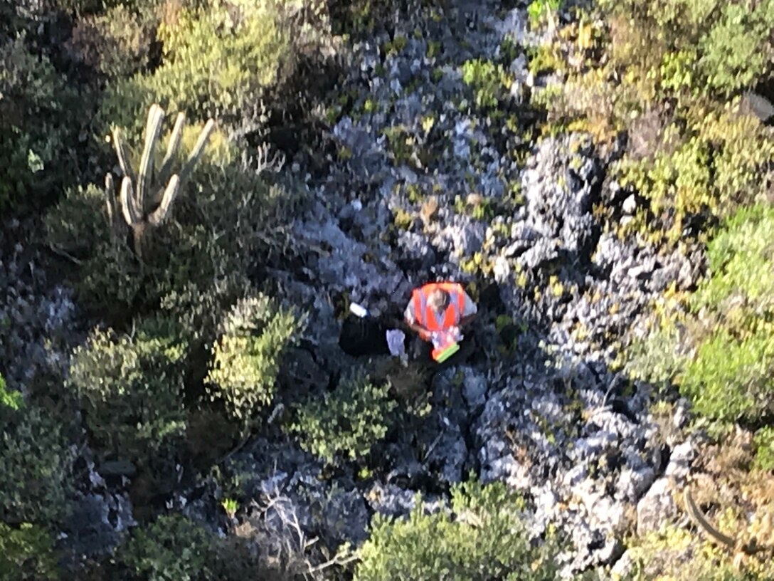 The crew of a Coast Guard MH-65 Dolphin helicopter from Air Station Borinquen rescued a missing hunter July 13, 2018, on Mona Island, Puerto Rico.