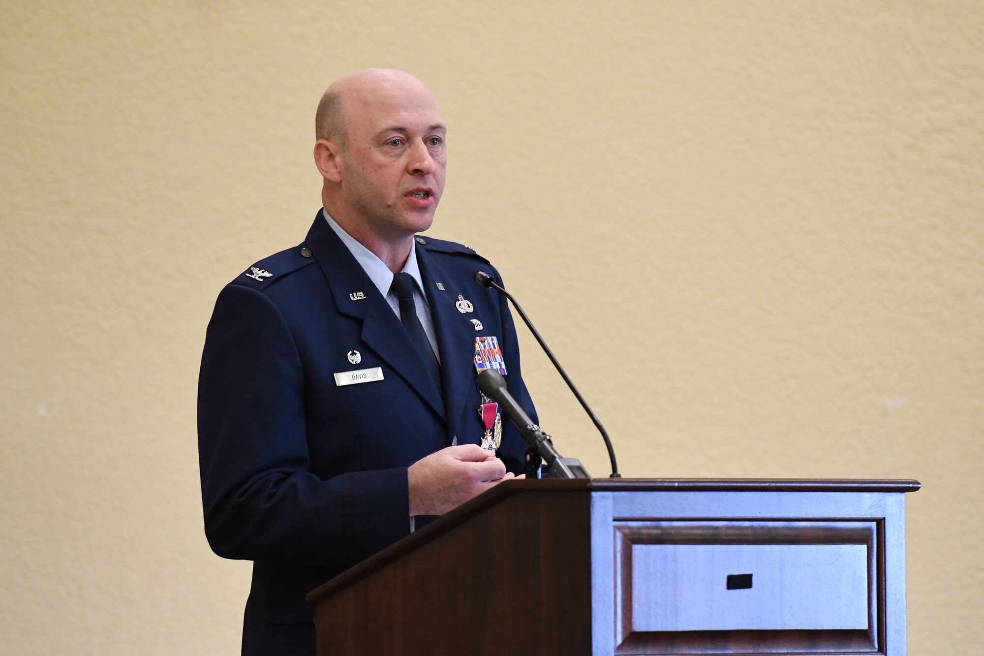 U.S. Air Force Col. Danny Davis, outgoing 81st Mission Support Group commander, delivers remarks during the 81st MSG change of command ceremony in the Bay Breeze Event Center at Keesler Air Force Base, Mississippi, July 19, 2018. Davis relinquished command of the 81st MSG and will be assigned to 2nd Air Force until he retires in September 2018, with more than 24 years of military service. (U.S. Air Force photo by Kemberly Groue)