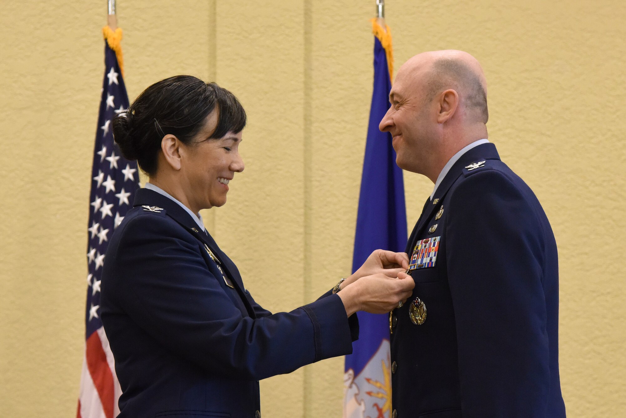 U.S. Air Force Col. Debra Lovette, 81st Training Wing commander, presents Col. Danny Davis, outgoing 81st Mission Support Group commander, with a Legion of Merit medal during the 81st MSG change of command ceremony in the Bay Breeze Event Center at Keesler Air Force Base, Mississippi, July 19, 2018. Davis relinquished command of the 81st MSG and will be assigned to 2nd Air Force until he retires in September 2018, with more than 24 years of military service. (U.S. Air Force photo by Kemberly Groue)