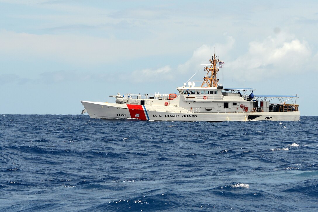 The crew of the U.S. Coast Guard Cutter Joseph Gerczak (WPC 1126) on patrol off the coast of Waikiki, July 4, 2018. The fast response cutter’s crew participated in an operation to keep swimmers and boaters safe during a Fourth of July celebration on the waters off Waikiki. U.S. Coast Guard photo by Petty Officer 3rd Class Matthew West.