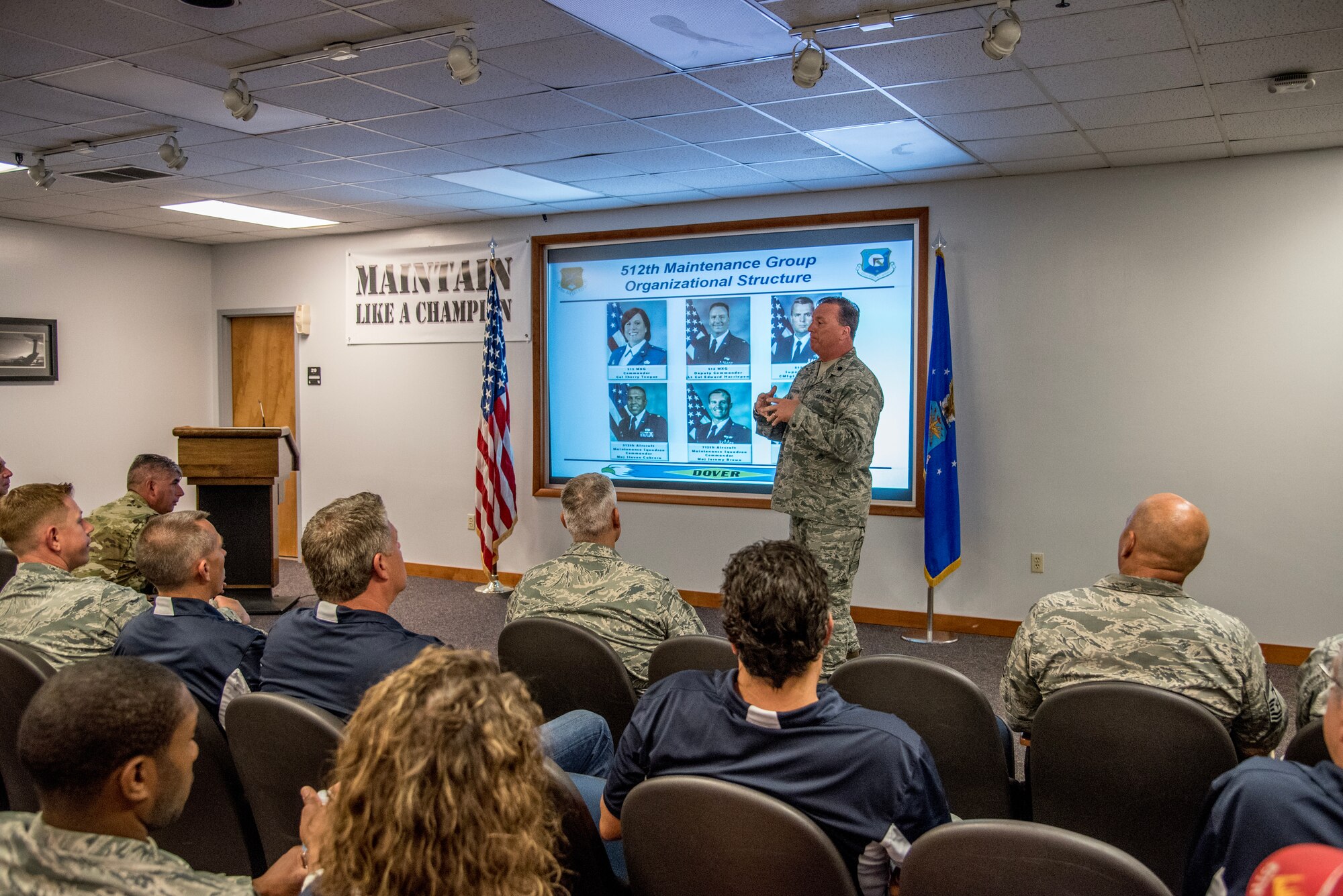 Lt. Col. Edward Hassiepen, 512th Maintenance Group deputy commander, speaks to honorary commanders at Dover Air Force Base, Del., July 19, 2018. Team Dover invited honorary commanders for a tour of the base's maintenance facilities providing them with hands-on experience learning the maintenance group mission. (U.S. Air Force photo by Staff Sgt. Damien Taylor)