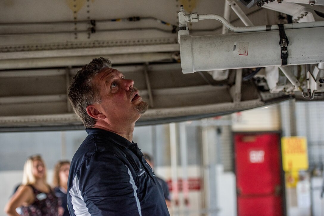 David Repass, 512th Aircraft Maintenance Squadron honorary commander, examines the underside of a C-5M Super Galaxy tail at Dover Air Force Base, Del., July 19, 2018. Team Dover honorary commanders toured a C-5M gaining an in-depth understanding of the work required to maintain its optimal mission-performance capabilities. (U.S. Air Force photo by Staff Sgt. Damien Taylor)