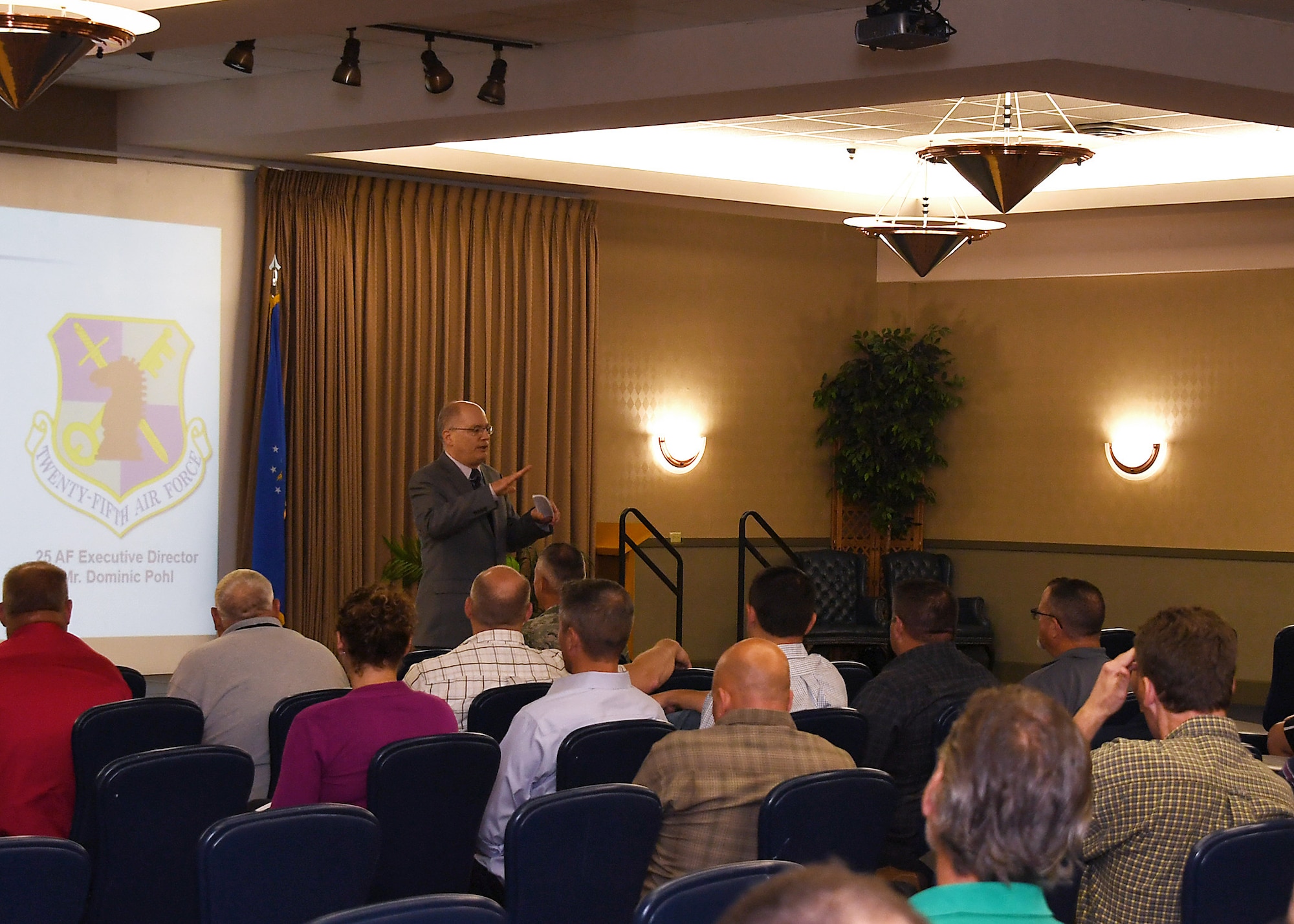 Dominic Pohl, 25th Air Force executive director, speaks at an all-call for base civilian employees July 19, 2018, on Grand Forks Air Force Base, North Dakota. Pohl’s presentation was provided insight on what the 25th AF is and what its missions are across the Unites States. (U.S. Air Force photo by Airman 1st Class Elora J. Martinez)