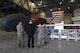 Dominic Pohl, 25th Air Force executive director, center, listens to Chief Master Sgt. Shannon Thomas, 69th Maintenance Group superintendent, center-right, explain the intelligence, surveillance and reconnaissance capabilities of the RQ-4 Global Hawk July 20, 2018, on Grand Forks Air Force Base, North Dakota. The 69 MXS mission plays a large role on Grand Forks AFB, operating Global Hawk missions year-round to offer ISR abilities worldwide. (U.S. Air Force photo by Airman 1st Class Elora J. Martinez)