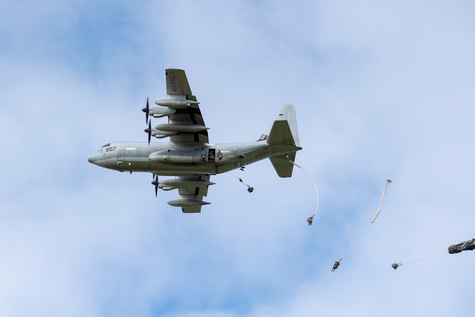 Paratroopers from U.S. Army Alaska’s 4th Infantry Brigade Combat Team (Airborne), 25th Infantry Division descend toward Malemute Drop Zone at Joint Base Elmendorf-Richardson, Alaska, July 17, 2018. More than 400 Soldiers parachuted as part of a field training exercise, executing tactical movements and setting up defensive positions while performing an airfield assault.