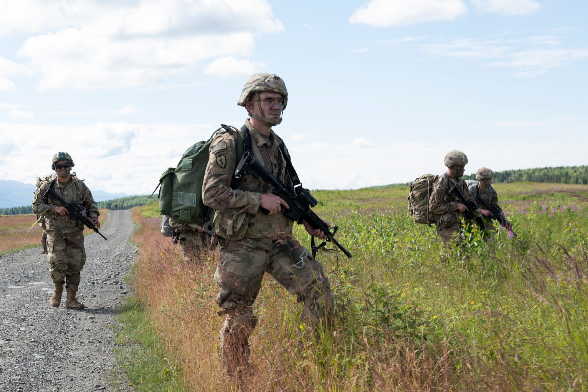 Paratroopers from U.S. Army Alaska’s 4th Infantry Brigade Combat Team (Airborne), 25th Infantry Division descend toward Malemute Drop Zone at Joint Base Elmendorf-Richardson, Alaska, July 17, 2018. More than 400 Soldiers parachuted as part of a field training exercise, executing tactical movements and setting up defensive positions while performing an airfield assault.
