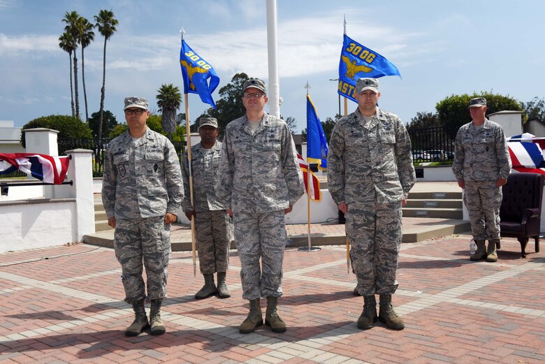 Col. Michael Hough, 30th Space Wing commander, Col. Curtis Hernandez, 30th Operations Group commander, Lt. Col. Kenneth Decker, 4th Space Launch Squadron commander, and Lt. Col. Brian Chatman, 1st Air and Space Test Squadron commander, stand at attention during the 30th Launch Group deactivation ceremony on July 20, 2018, at Vandenberg Air Force Base, Calif. The 30th Space Wing inactivated the 30th LCG, merging their range responsibilities and personnel with the 30th OG. (U.S. Air Force photo by Tech. Sgt. Jim Araos/Released)
