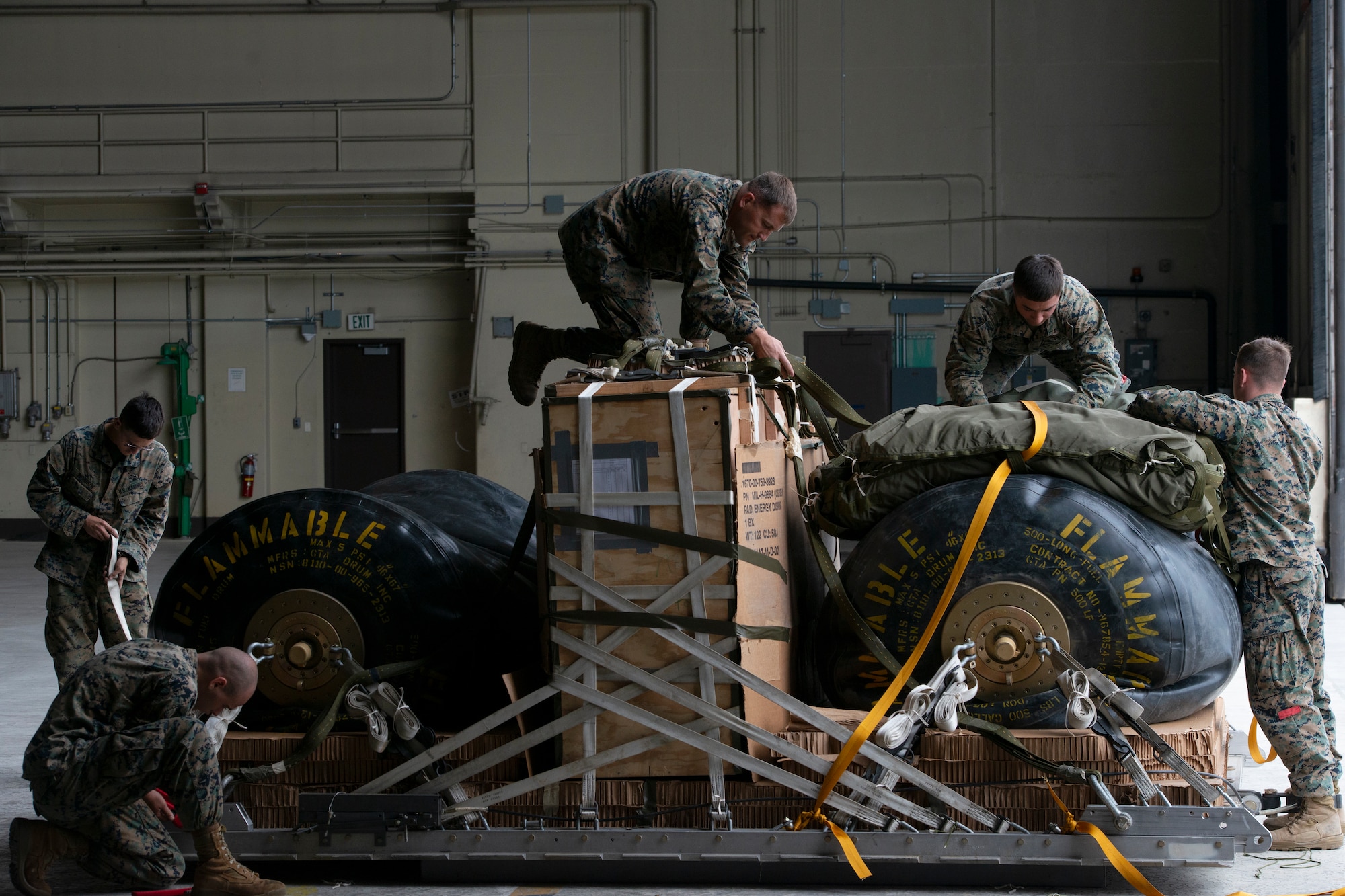 Marines of the 3d Transportation Support Battalion, VMGR-152, and Marine Wing Support Squadron 172 are participating in Exercise Kodiak Mace. During the exercise, through July 25, Marines are conducting joint precision air drop system, cargo, and personnel airdrops.
