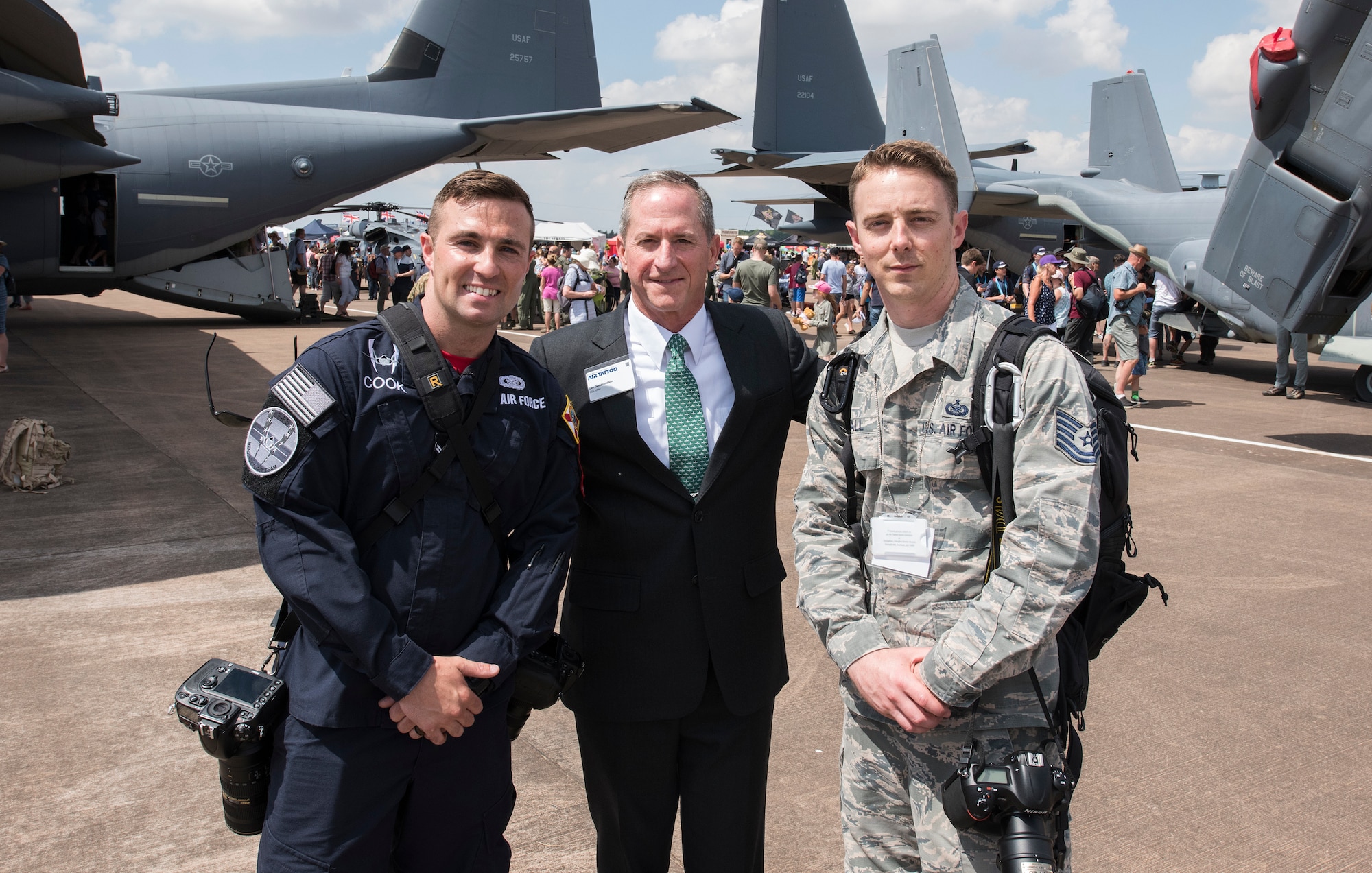 Airman 1st Class Alexander Cook, F-35 Heritage Flight Team public affairs, and Tech. Sgt. Brian Kimball, 501st Combat Support Wing photojournalist, pose for a photo with Chief of Staff of the Air Force, Gen. David Goldfein July 14, 2018 at Royal Air Force Fairford, England. As a member of F-35 HFT, Cook documents air shows around the world showcasing Air Force heritage.