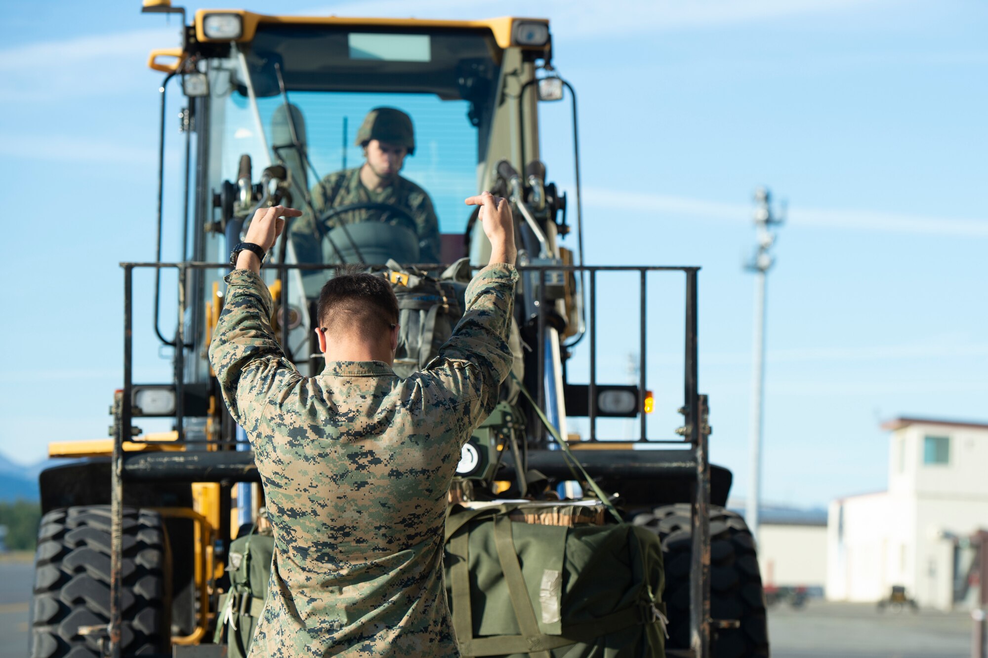 Marines of the 3d Transportation Support Battalion, VMGR-152, and Marine Wing Support Squadron 172 are participating in Exercise Kodiak Mace. During the exercise, through July 25, Marines are conducting joint precision air drop system, cargo, and personnel airdrops.