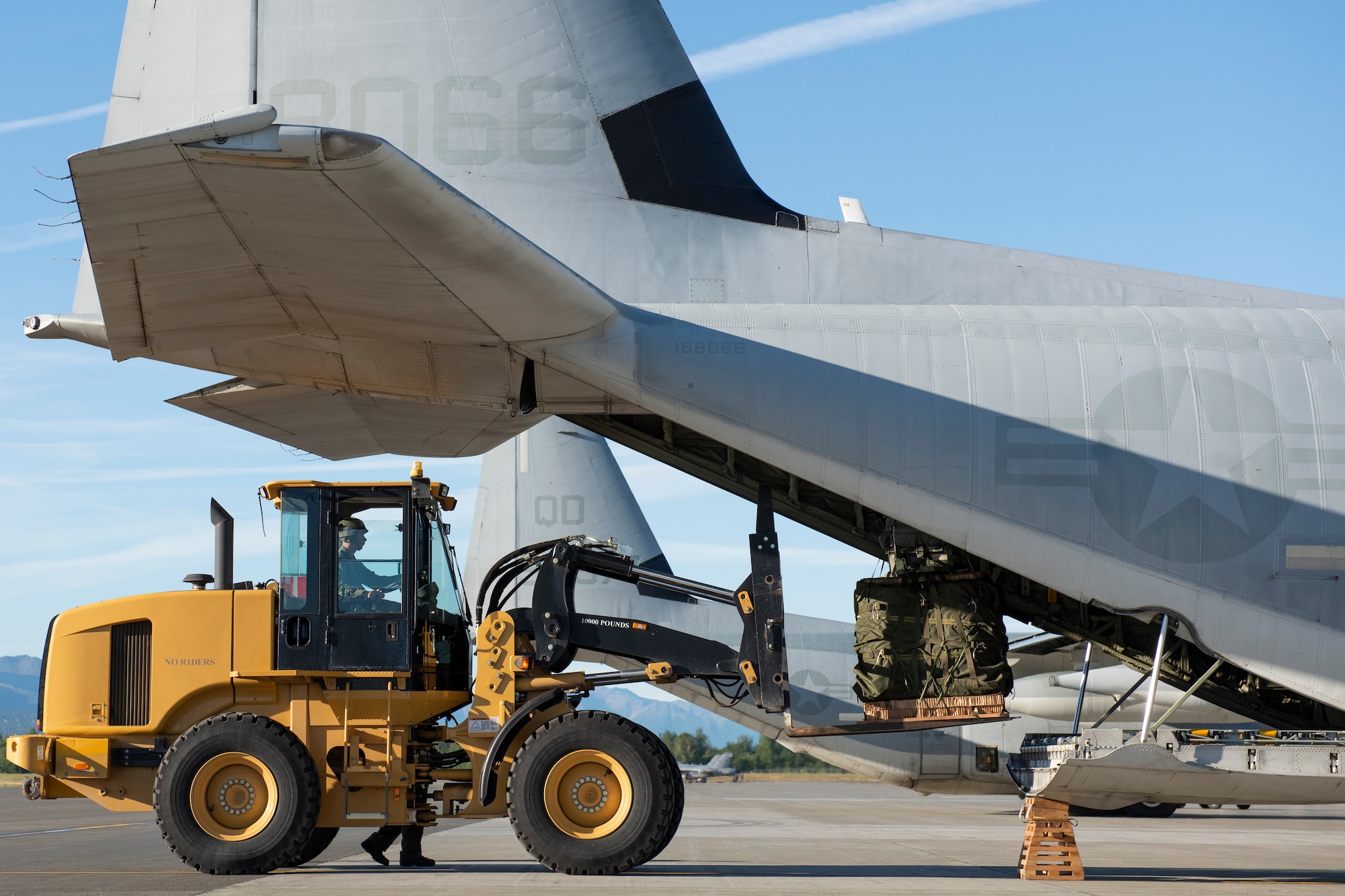 Marines of the 3d Transportation Support Battalion, VMGR-152, and Marine Wing Support Squadron 172 are participating in Exercise Kodiak Mace. During the exercise, through July 25, Marines are conducting joint precision air drop system, cargo, and personnel airdrops.