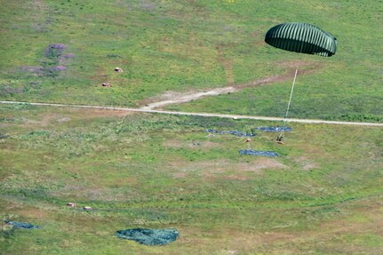 Marines of the 3d Transportation Support Battalion, VMGR-152, and Marine Wing Support Squadron 172 are participating in Exercise Kodiak Mace. During the exercise, through July 25, Marines are conducting joint precision air drop system, cargo, and personnel airdrops.