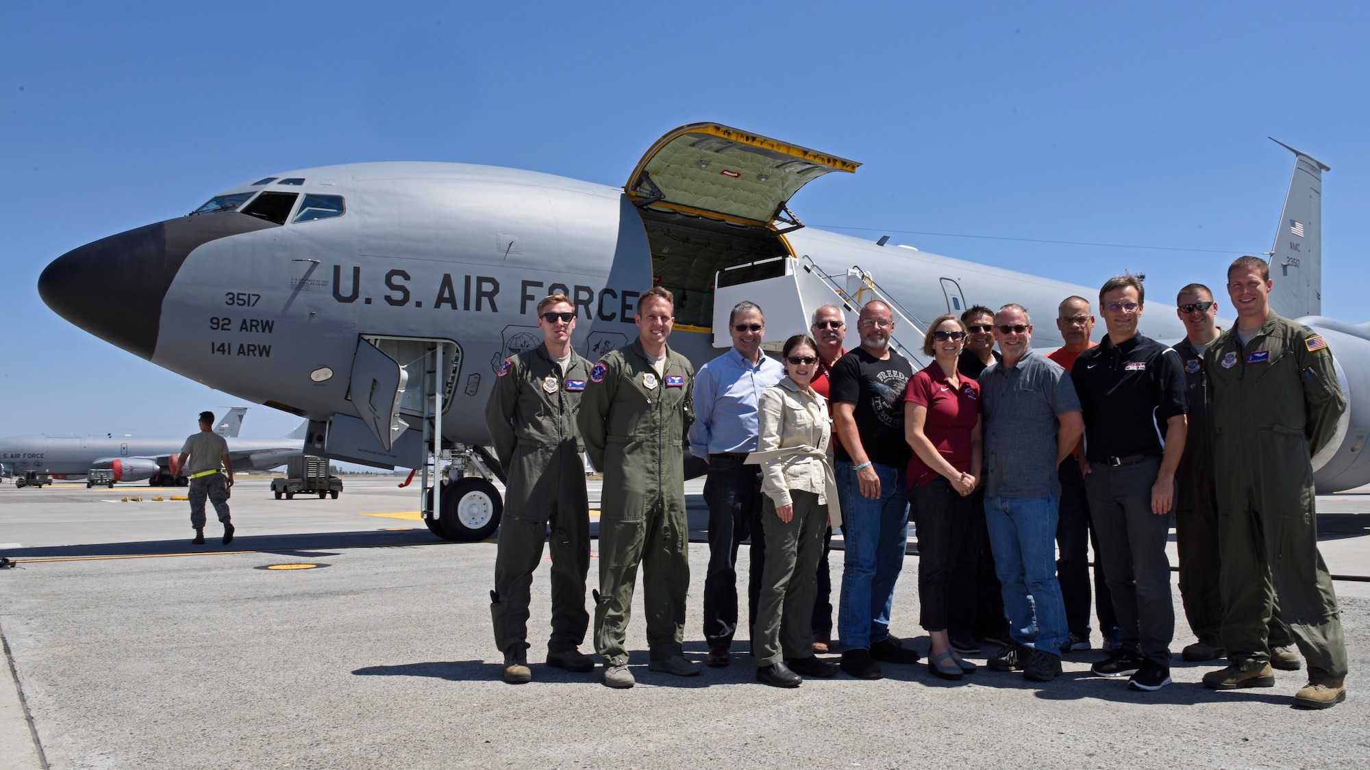 Four 93rd Air Refueling Squadron aircrew members and a group of Spokane-area school district superintendents pose for a photo after an orientation flight at Fairchild Air Force Base, Washington, July 18, 2018. As the Air Force enhances their partnerships with schools, educators gain more insight into Air Force opportunities and can enhance students’ educational experiences. This partnership benefits recruiting while creating a more efficient way for Airmen and their families to address education concerns. (U.S. Air Force photo/Airman Jesenia Landaverde)