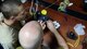 Two Airmen connect wires together
