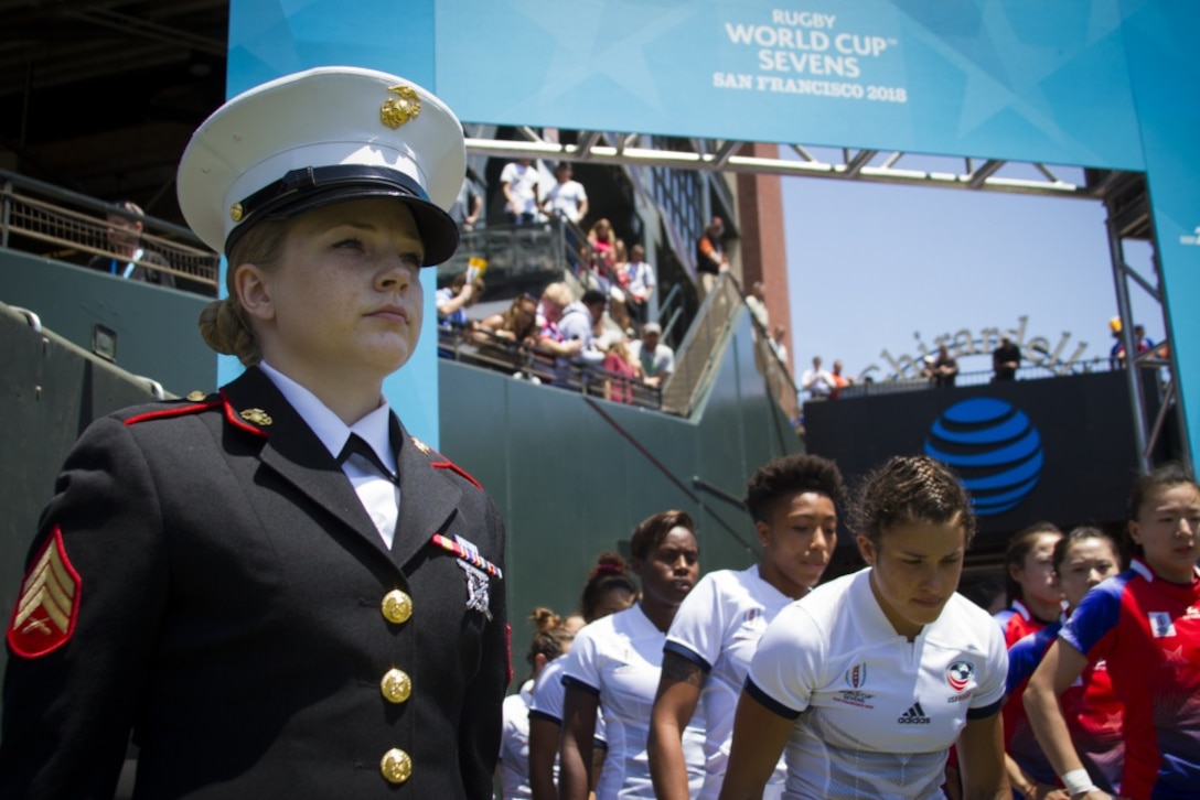 Sgt. Nichole Stoehrer, a marketing and communication Marine at Recruiting Station San Francisco, California, stands in the honor guard to welcome the USA Rugby women’s team onto the pitch during the Rugby World Cup Sevens in San Francisco, July 20, 2018. This year, the Marine Corps attended the Rugby World Cup Sevens to support their partnership with USA Rugby, as rugby players share the same fighting spirit with Marines. Stoehrer is from Rutherfordton, North Carolina, and to the right of Stoehrer stands Nicole Heavirland, a native of Whitefish, Montana. (US Marine Corps photo by Lance Cpl. Naomi Marcom)