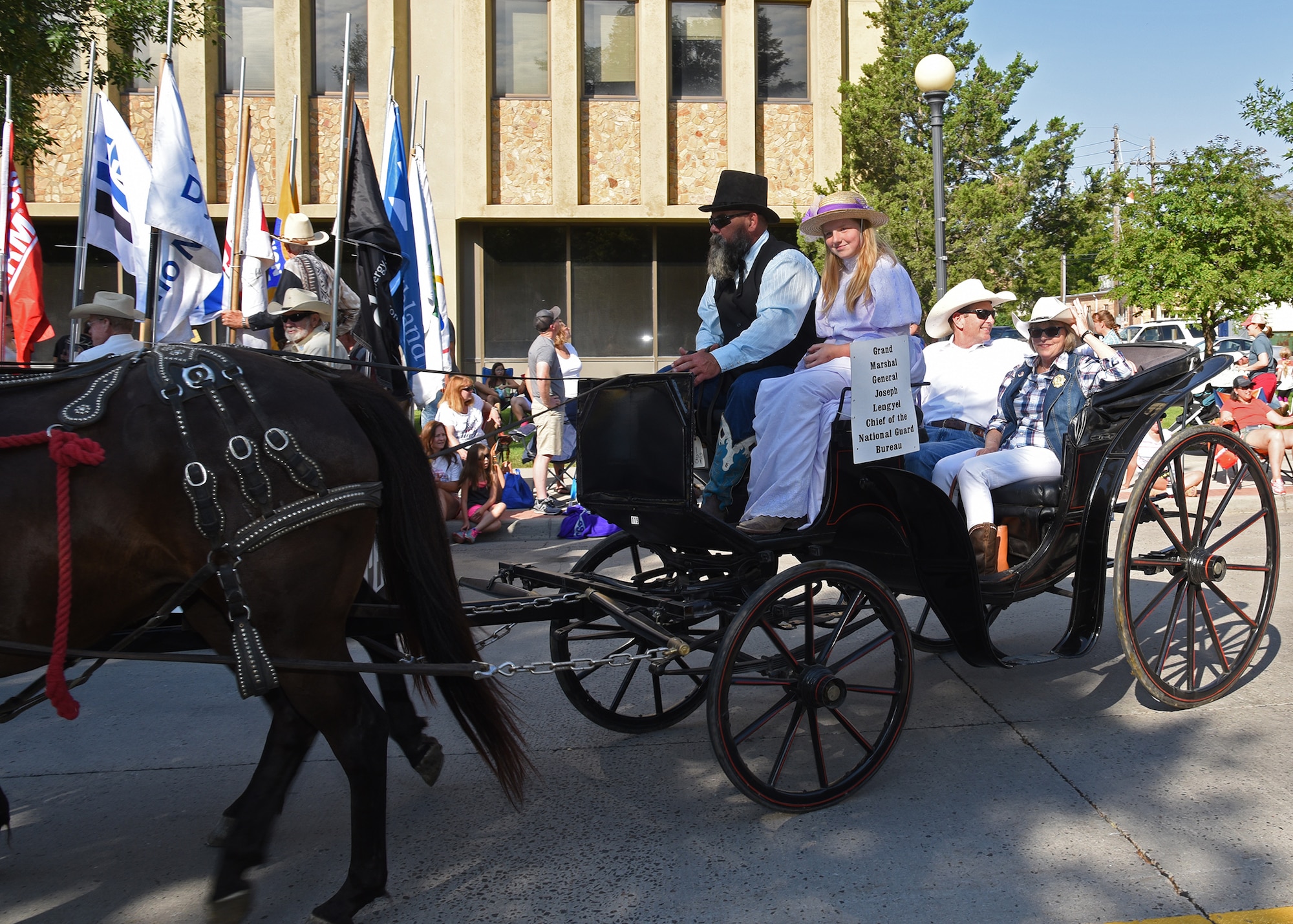 Gen. Joseph Lengyel, National Guard Bureau chief, rides along Capitol Avenue during the 122nd Cheyenne Frontier Days opening grand parade in Cheyenne, Wyo., July 21, 2018. Lengyel served as the Grand Marshal of the parade and opening ceremonies which officially mark the beginning of CFD. The F.E. Warren Air Force Base and Cheyenne communities came together to celebrate the CFD rodeo and festival, which runs from July 20-29. (U.S. Air Force photo by Glenn Robertson)